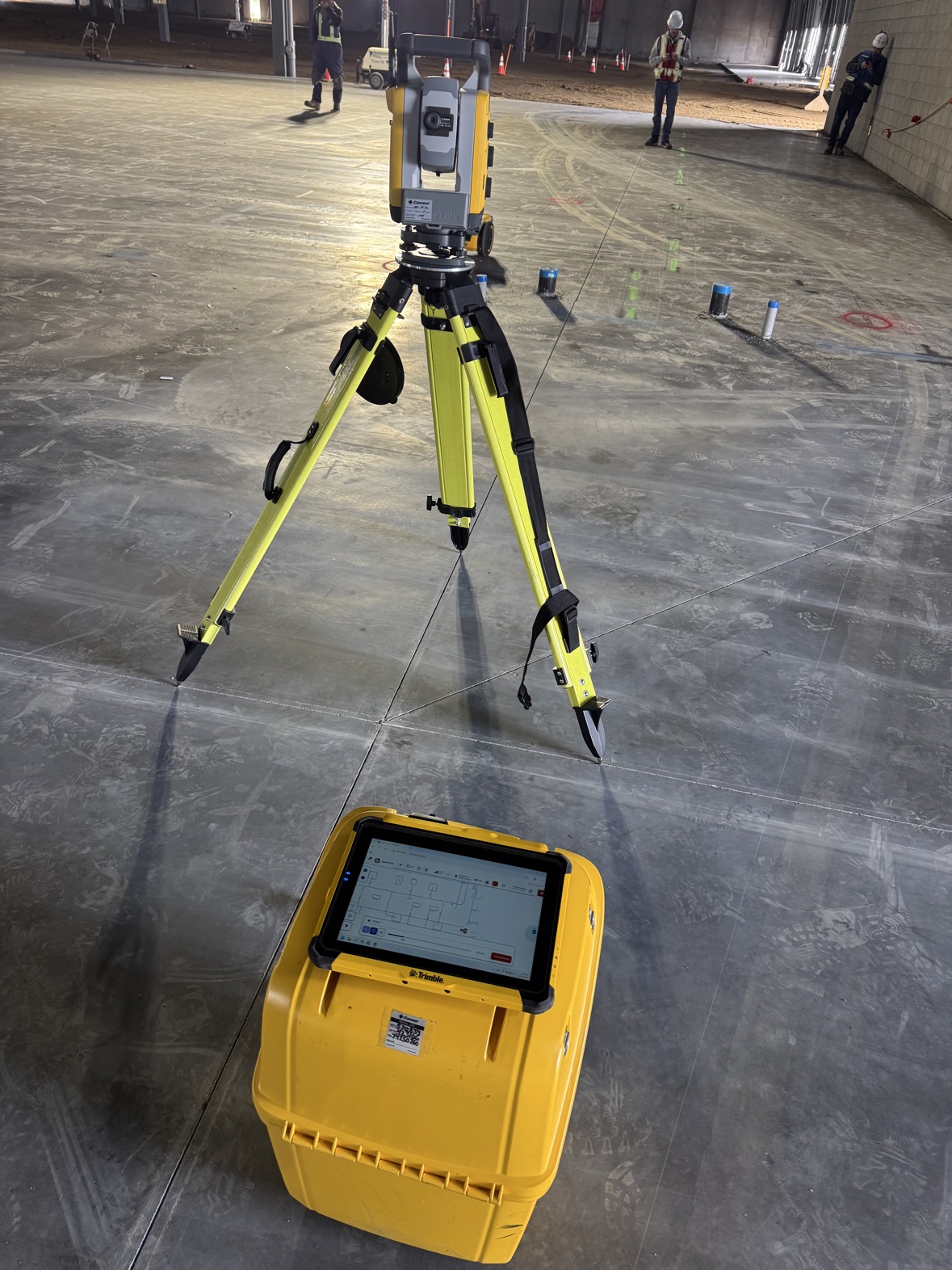 Robotic total station and tablet with the digital layout plan