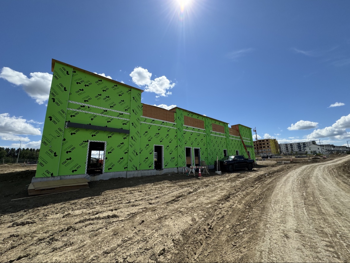 Building wrapped in air barrier membrane