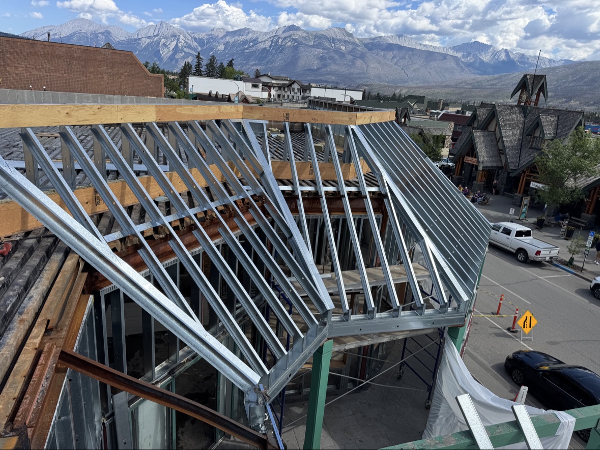 Steel roof framing with mountain backdrop