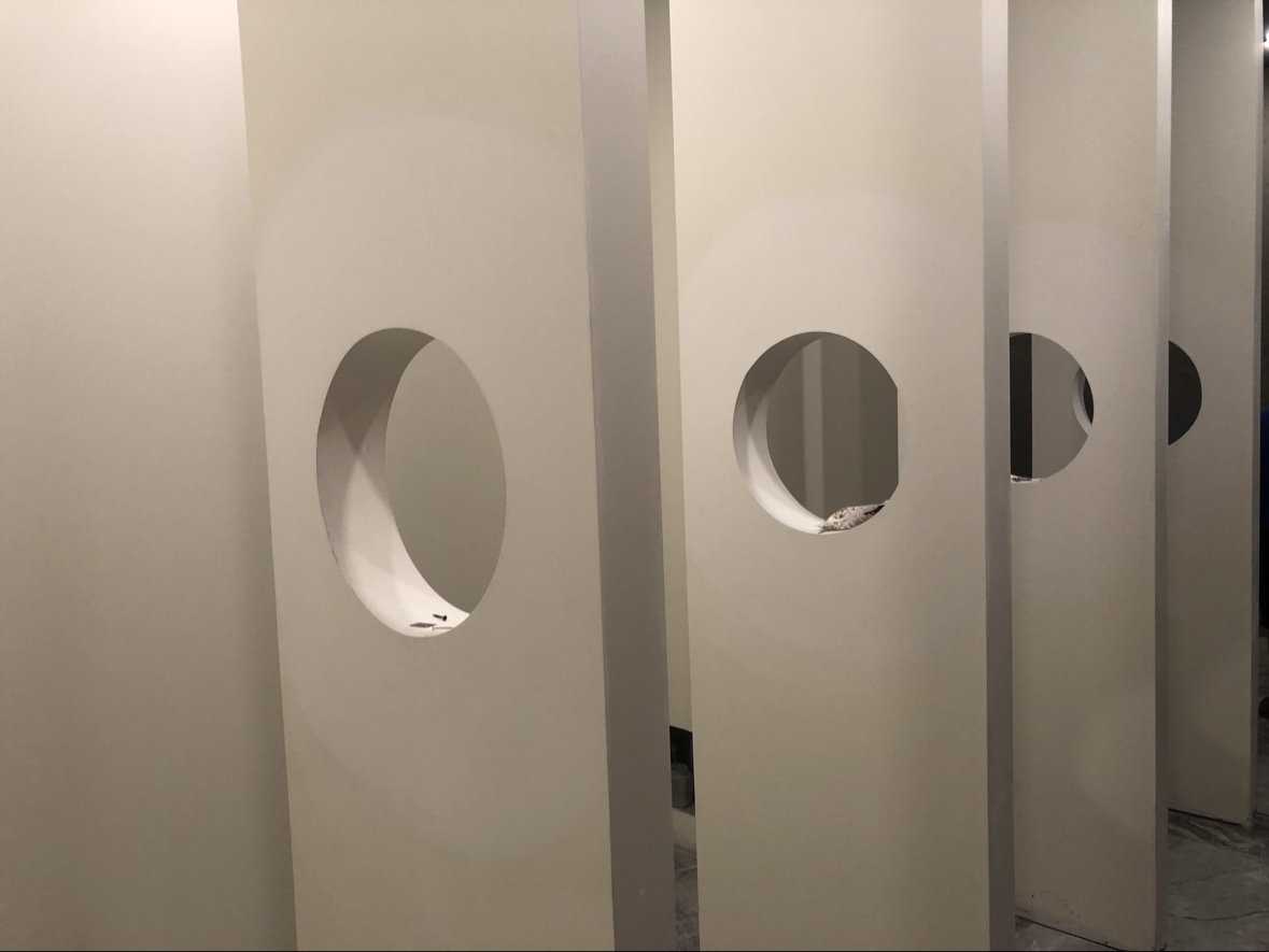 Finished drywall partitions with circular cutouts